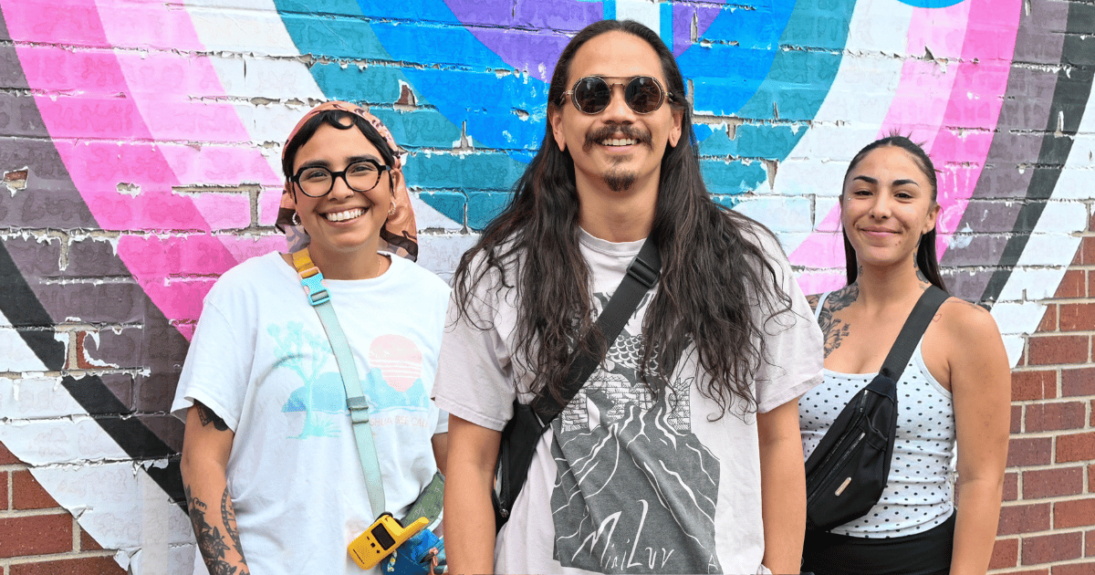 Class 1 Teaching Staff standing together in front of the Hope mural